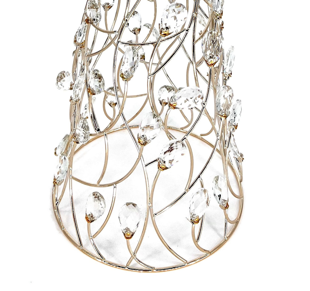 Close-up of the Mark Roberts Crystal Cone Tree's lower half: curved gold wire lattice set with clear faceted oval drops in small gold caps, rising from a round gold base ring.