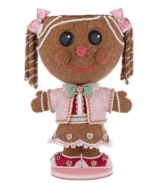 Katherine's Collection Sugar E. Sweet Gingerbread Girl Candy Container on a plain white background, showing full front view — pink quilted jacket, green bow, braided pigtails with candy-cane striped wraps, heart appliques on the skirt, and peppermint-trimmed shoes.