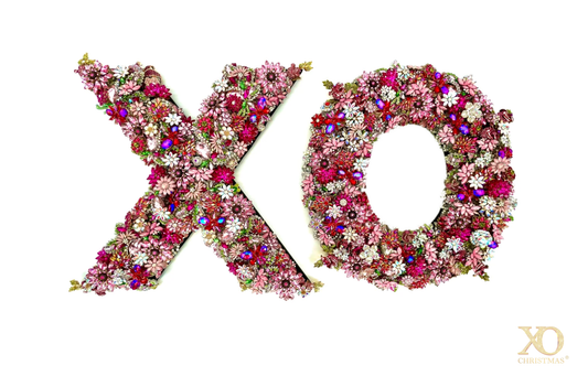 Hot Pink Rhinestone Jeweled XO Wall Art Pair, the letters X and O covered in hot pink, burgundy, and pink rhinestone flowers with green leaves and iridescent accents. XO Christmas logo in the lower right.