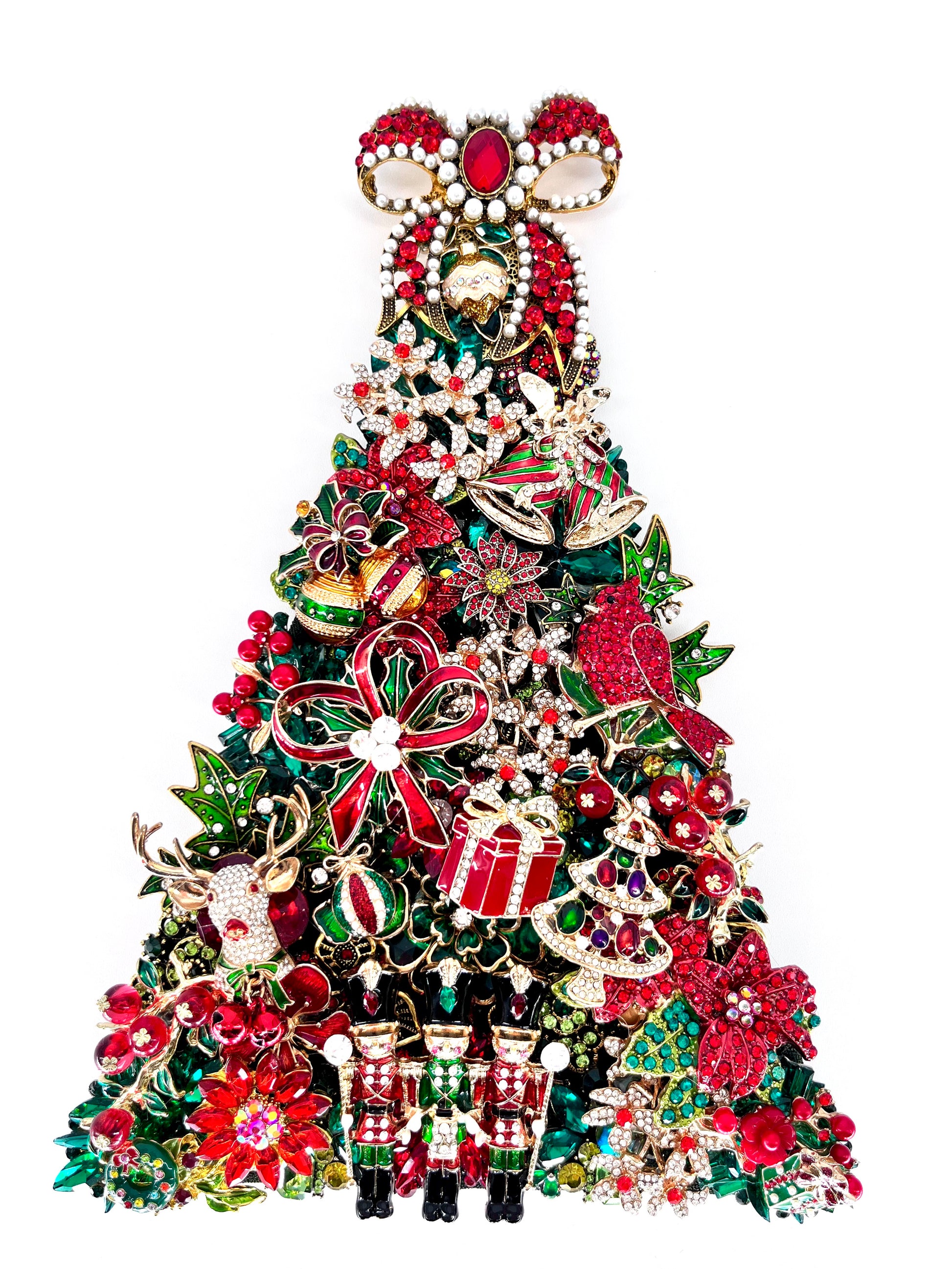 Jeweled Christmas tree sculpture adorned with red, green, and gold rhinestones, nutcrackers, cardinal, poinsettias, reindeer, and a jeweled bow topper