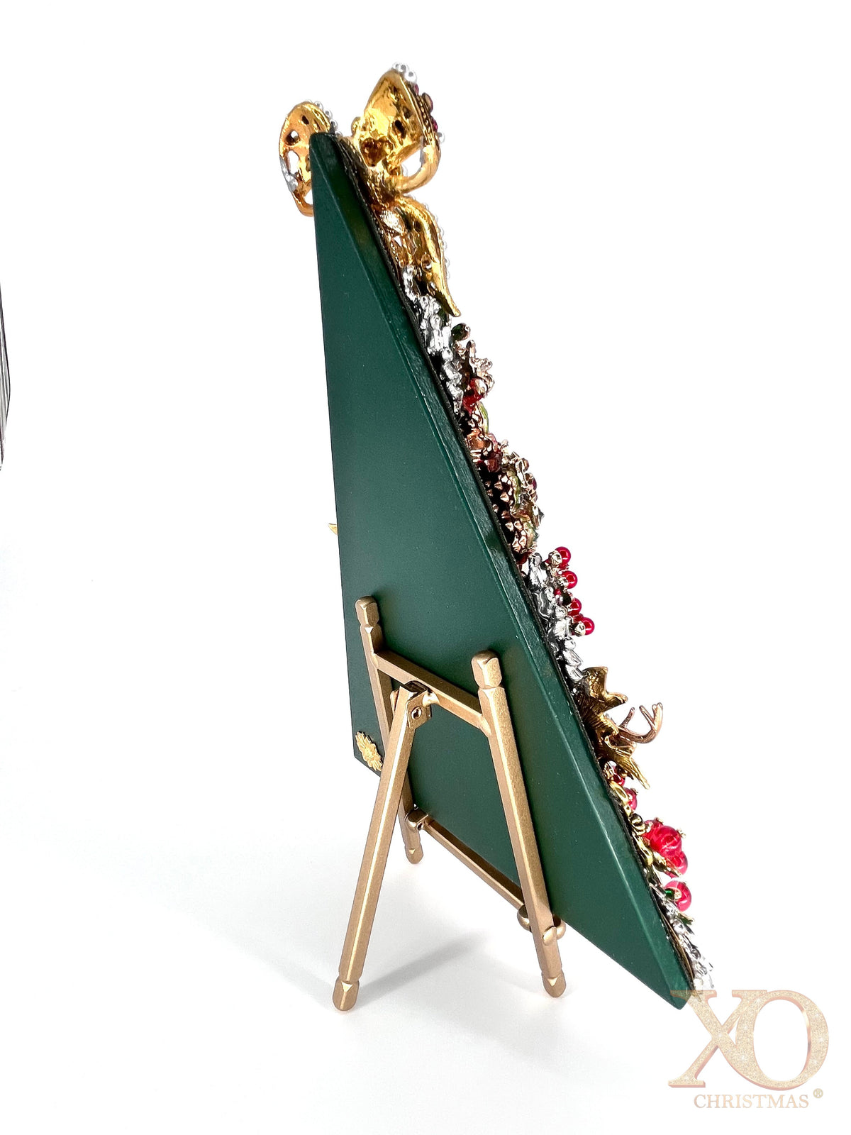 Back angle view of jeweled Christmas tree sculpture on gold easel, showing green backing and dimensional rhinestone embellishments