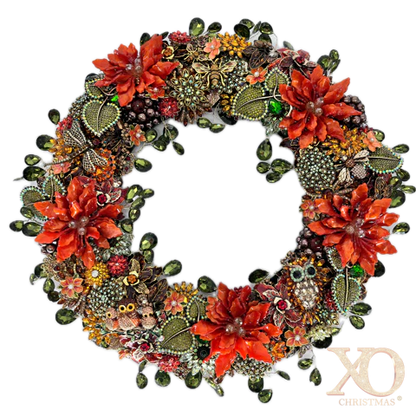 An ornate circular jeweled wreath decorated with large red-orange faux flowers, jeweled green leaves, beads, and small owl and butterfly embellishments, shown on a plain white background.

