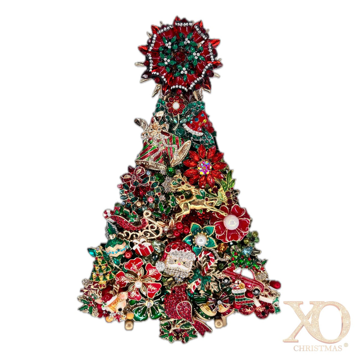 A Christmas tree-shaped jeweled tree made densely with crystal and rhinestone red, green, gold, and silver holiday-themed jewelry elements, including floral motifs, ornaments, and a star topper, shown on a plain white background.