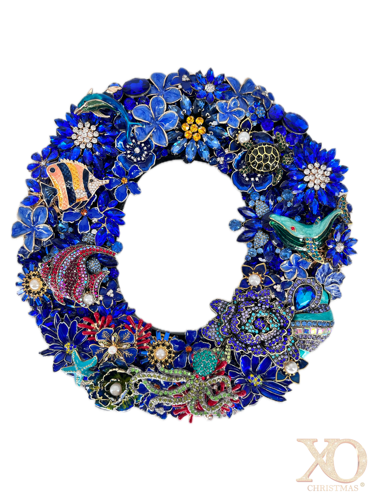 Sapphire blue rhinestone jeweled letter O with an octopus, whale, dolphin, and sea turtle detail, accented with faux pearl centers and coral red and gold tones