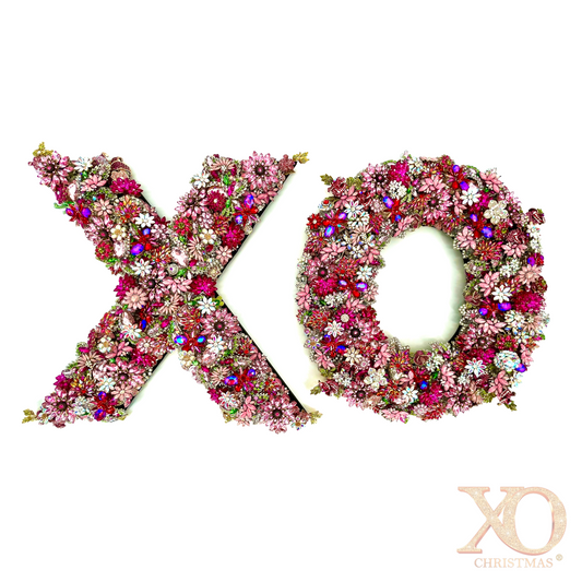 Letter X and O jeweled wall art pair densely covered in hot pink, pink, fuchsia, and magenta rhinestone florals with aurora borealis and jeweled accents
