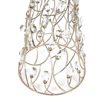 Close-up of the Mark Roberts Crystal Cone Tree's lower half: curved gold wire lattice set with clear faceted oval drops in small gold caps, rising from a round gold base ring.