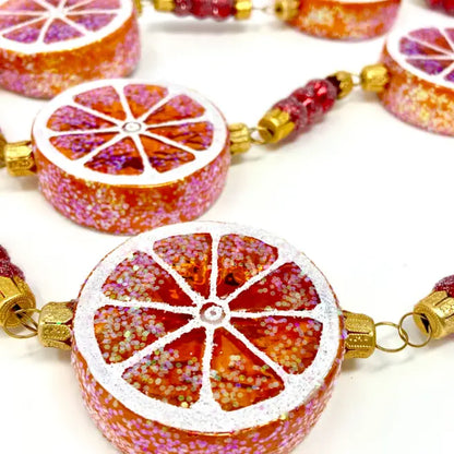 Sicilian Orange Slices Garland glass ornaments for holiday décor and seasonal displays.
