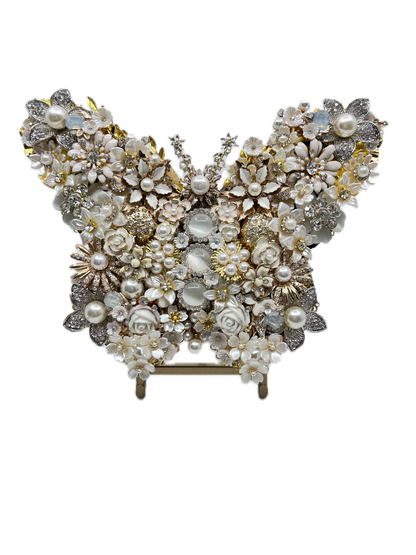 White Pearl Jeweled Butterfly Sculpture displayed on gold easel, adorned with ivory and cream floral brooches, faux pearls, porcelain roses, and crystal accents — handmade in the USA