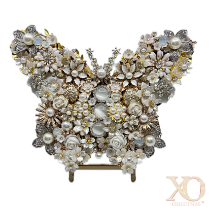 White Pearl Jeweled Butterfly Sculpture displayed on gold easel, adorned with ivory and cream floral brooches, faux pearls, porcelain roses, and crystal accents