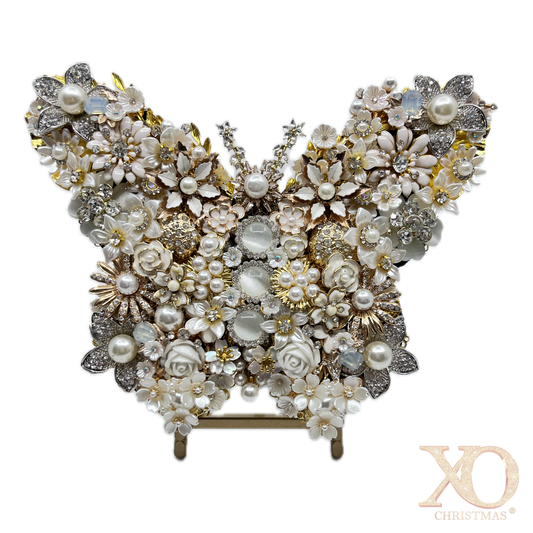 White Pearl Jeweled Butterfly Sculpture displayed on gold easel, adorned with ivory and cream floral brooches, faux pearls, porcelain roses, and crystal accents